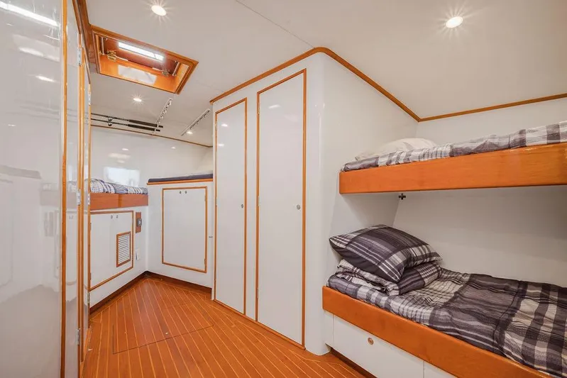 Chunda Yacht Photos Pics Cozy cabin interior of 1998 Merritt 48 yacht with bunk beds and wood accents.