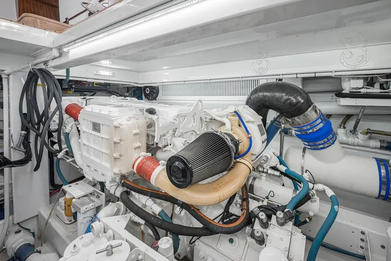 Chunda Yacht Photos Pics Engine room of a 1998 Merritt 48 yacht, showcasing detailed mechanical components.