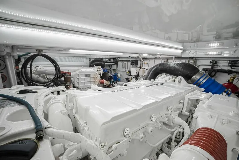 Chunda Yacht Photos Pics Engine room of a 1998 Merritt 48 yacht, showcasing clean, organized machinery.