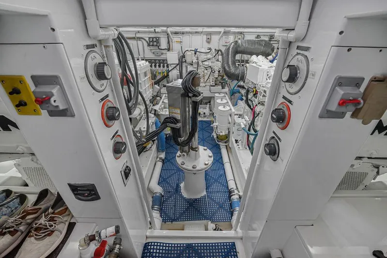 Chunda Yacht Photos Pics Engine room of a 1998 Merritt 48 yacht, featuring control panels and mechanical components.