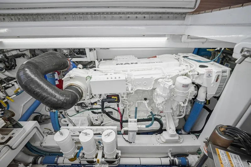 Chunda Yacht Photos Pics Engine room of a 1998 Merritt 48 yacht featuring a MAN diesel engine.