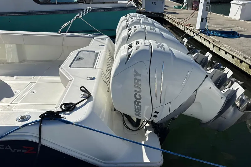 Showtime Yacht Photos Pics 2015 SeaVee 390Z boat with triple Mercury Verado engines docked at a marina.