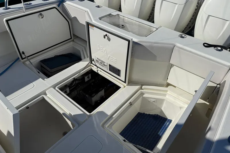 Showtime Yacht Photos Pics 2015 SeaVee 390Z boat compartments open, showcasing storage and engine access.