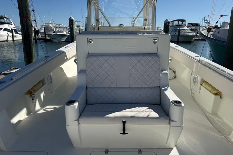 Showtime Yacht Photos Pics 2015 SeaVee 390Z boat interior with cushioned seating at marina.
