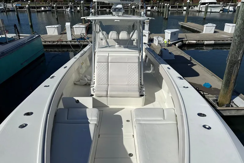 Showtime Yacht Photos Pics 2015 SeaVee 390Z boat docked, featuring spacious seating and sleek design.