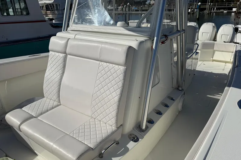 Showtime Yacht Photos Pics 2015 SeaVee 390Z boat interior with white quilted seating and stainless steel accents.