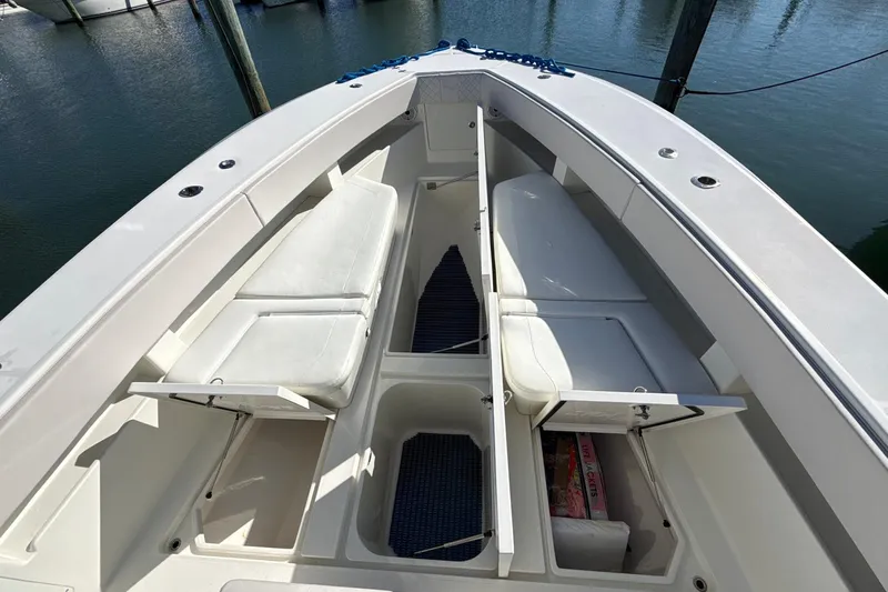 Showtime Yacht Photos Pics 2015 SeaVee 390Z boat interior with open storage compartments and cushioned seating.