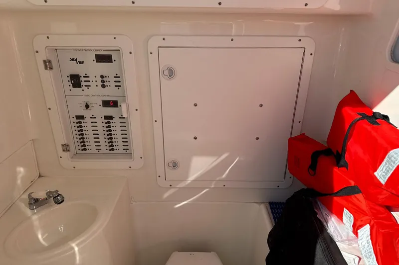 Showtime Yacht Photos Pics 2015 SeaVee 390Z control panel with life jackets and sink.