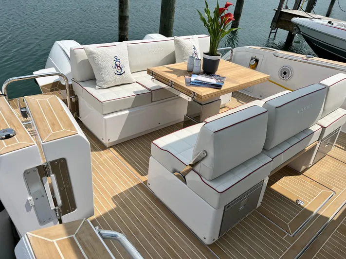  Yacht Photos Pics 2023 Pardo Yachts 38 Outboard, elegant deck with seating, table, and nautical decor.