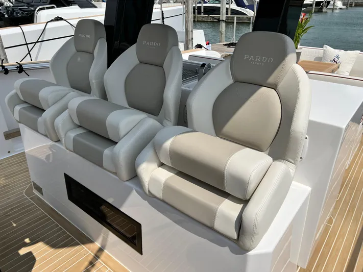  Yacht Photos Pics 2023 Pardo Yachts 38 Outboard luxury seating, featuring three plush, ergonomic chairs on deck.