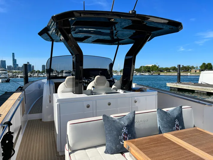  Yacht Photos Pics 2023 Pardo Yachts 38 Outboard, luxury deck view, modern seating, waterfront backdrop.