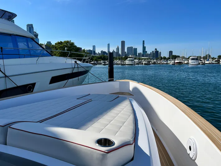  Yacht Photos Pics 2023 Pardo Yachts 38 Outboard docked with city skyline in background.