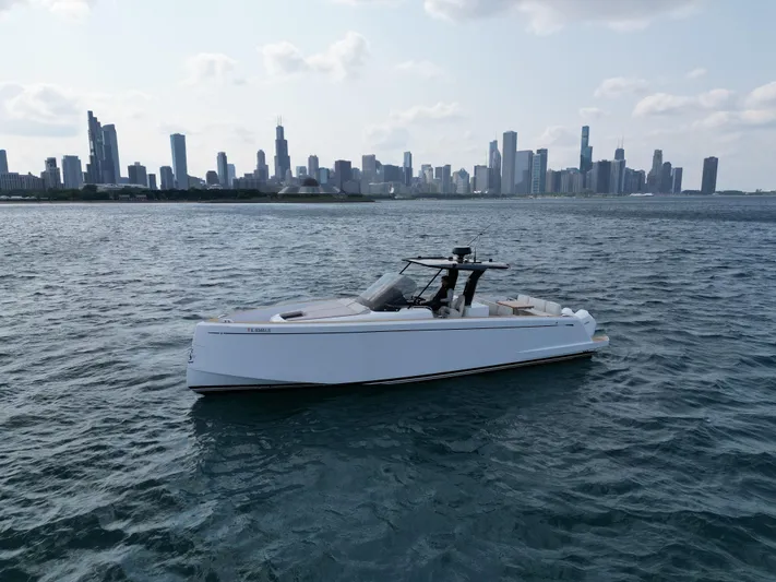  Yacht Photos Pics 2023 Pardo Yachts 38 Outboard cruising on water with city skyline in background.