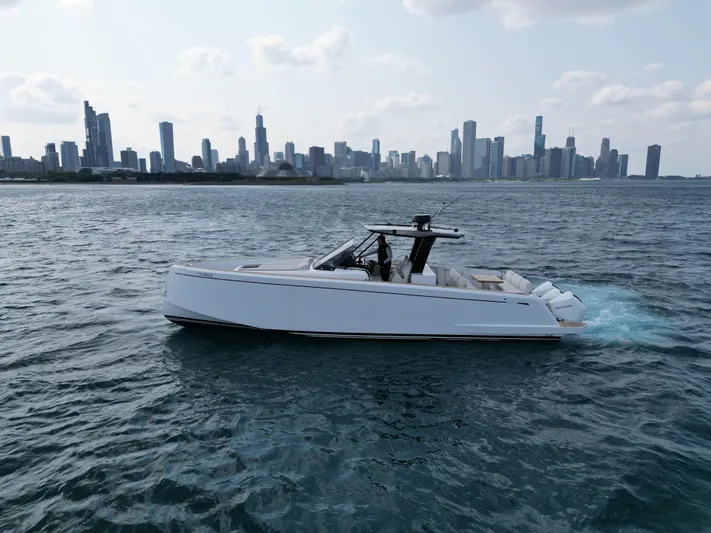 Yacht Photos Pics 2023 Pardo Yachts 38 Outboard cruising on water with city skyline in background.