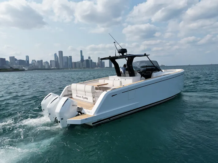 Yacht Photos Pics 2023 Pardo Yachts 38 Outboard cruising near city skyline on a sunny day.