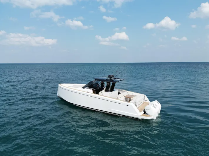 Yacht Photos Pics 2023 Pardo Yachts 38 Outboard cruising on open sea under blue sky.