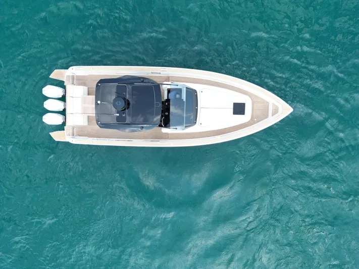  Yacht Photos Pics Aerial view of 2023 Pardo Yachts 38 Outboard on turquoise water.