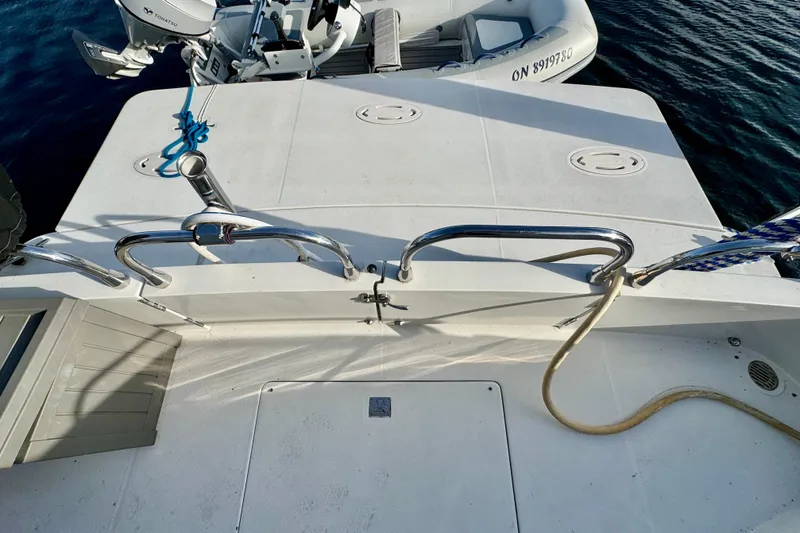 Water Music Yacht Photos Pics 2006 Carver 43 Motor Yacht deck with railing and inflatable boat.