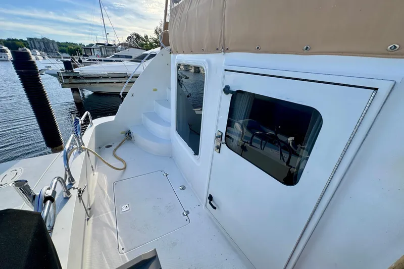 Water Music Yacht Photos Pics 2006 Carver 43 Motor Yacht docked, showcasing deck and cabin entrance.