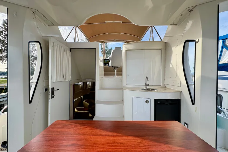 Water Music Yacht Photos Pics Interior view of 2006 Carver 43 Motor Yacht with kitchenette and seating area.