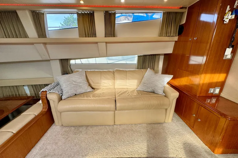 Water Music Yacht Photos Pics Luxurious interior of 2006 Carver 43 Motor Yacht with beige sofa and wooden cabinetry.