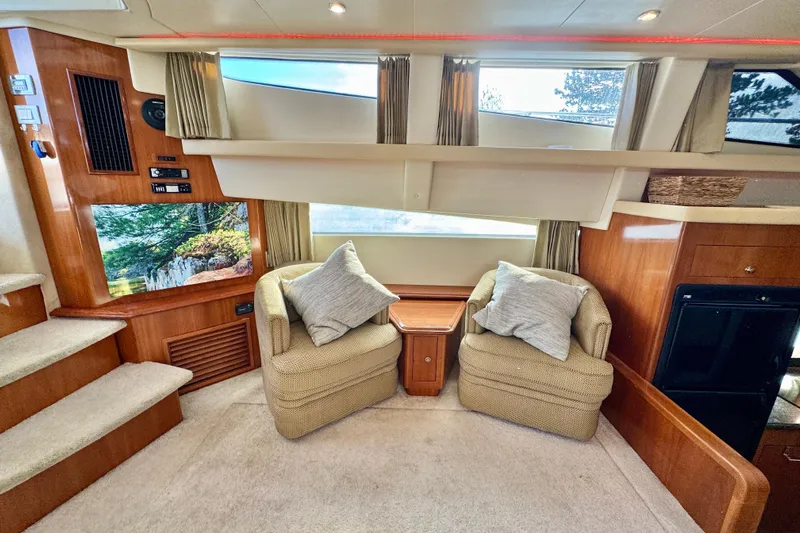 Water Music Yacht Photos Pics Interior of 2006 Carver 43 Motor Yacht with cozy seating and elegant wood finishes.