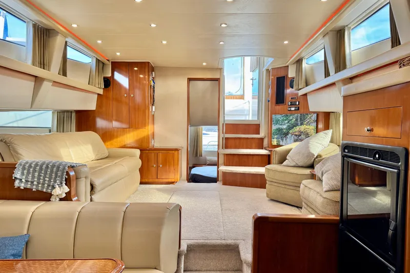 Water Music Yacht Photos Pics Luxurious interior of 2006 Carver 43 Motor Yacht with plush seating and elegant wood finishes.