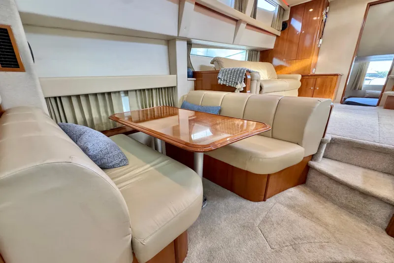 Water Music Yacht Photos Pics Interior of 2006 Carver 43 Motor Yacht with elegant seating and dining area.