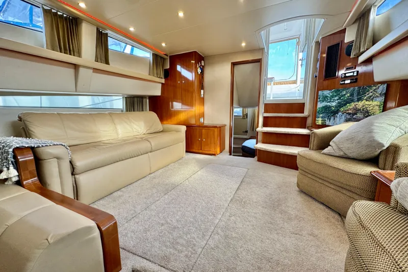 Water Music Yacht Photos Pics Luxurious interior of 2006 Carver 43 Motor Yacht with beige seating and elegant wood accents.