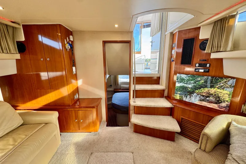 Water Music Yacht Photos Pics Luxurious interior of 2006 Carver 43 Motor Yacht with elegant wood finishes and cozy seating.