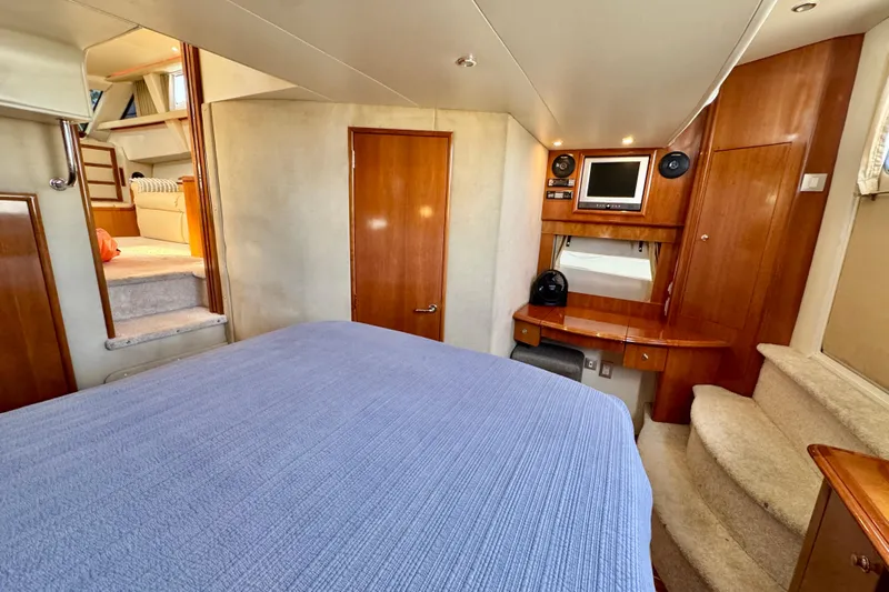 Water Music Yacht Photos Pics Luxurious interior of 2006 Carver 43 Motor Yacht with cozy bedroom and entertainment area.
