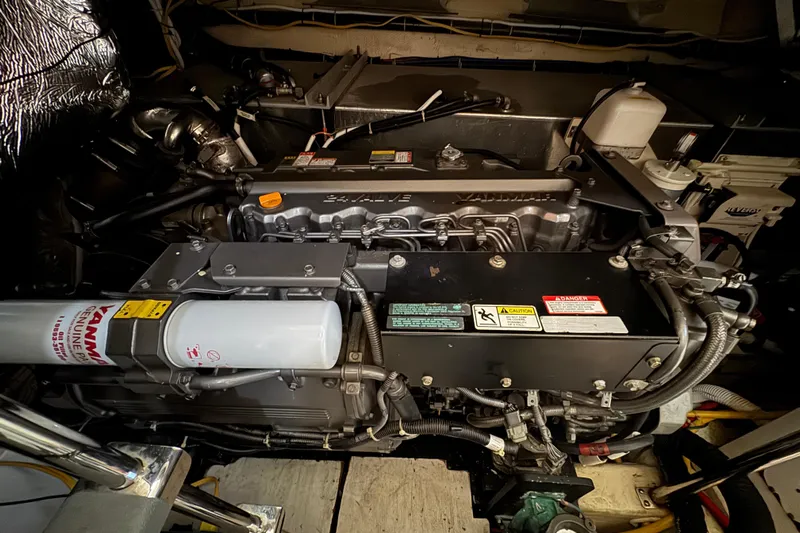 Water Music Yacht Photos Pics Engine room of a 2006 Carver 43 Motor Yacht, featuring a Yanmar engine.