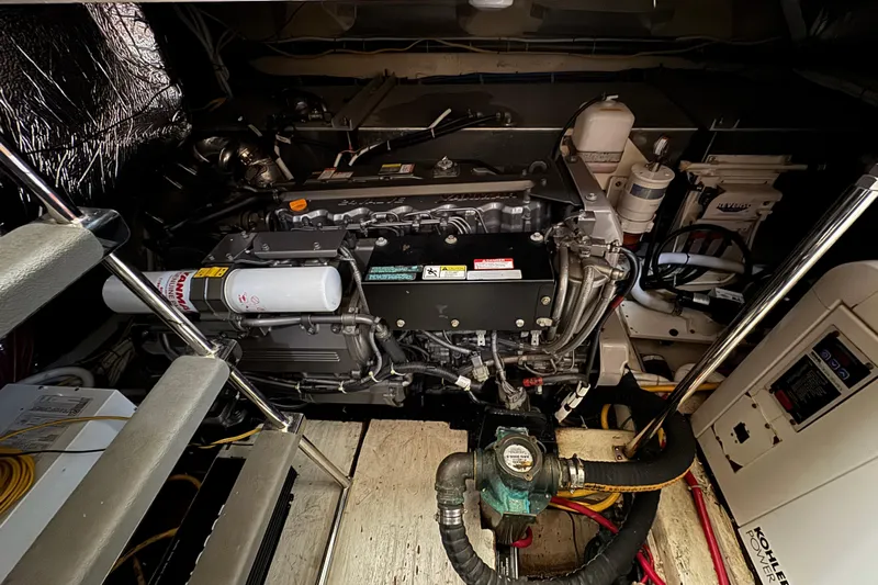 Water Music Yacht Photos Pics Engine room of a 2006 Carver 43 Motor Yacht, showcasing mechanical components.