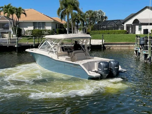  Yacht Photos Pics Grady-White 325 Freedom 2021 boat on water, sunny day.