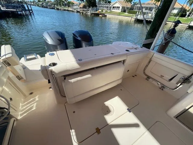  Yacht Photos Pics Grady-White 325 Freedom 2021 boat on water with twin outboard engines.