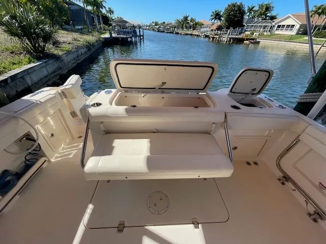  Yacht Photos Pics 2021 Grady-White 325 Freedom boat deck with seating and storage.