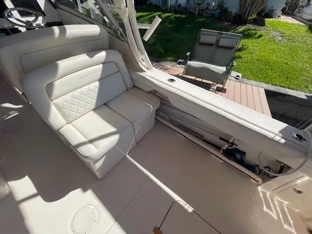  Yacht Photos Pics Interior of a 2021 Grady-White 325 Freedom boat with beige seating area.