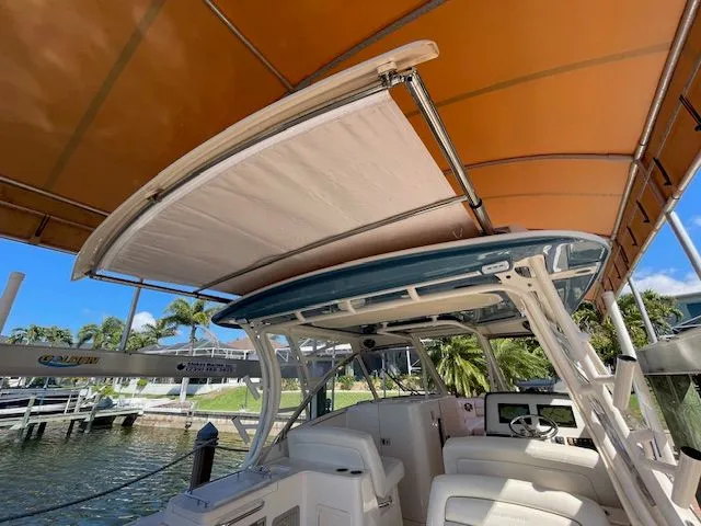  Yacht Photos Pics Grady-White 325 Freedom 2021 under orange canopy at dock.