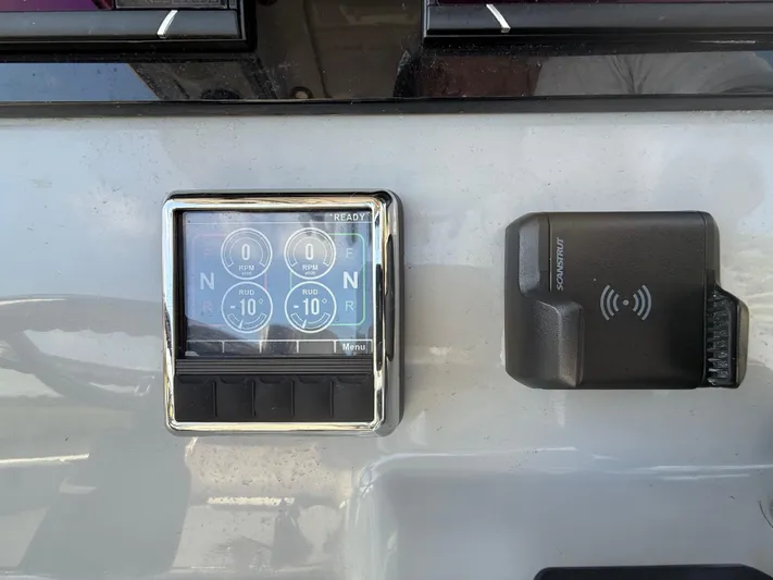  Yacht Photos Pics 2024 Sea Pro 262DLX dashboard with control panel and wireless charging pad.
