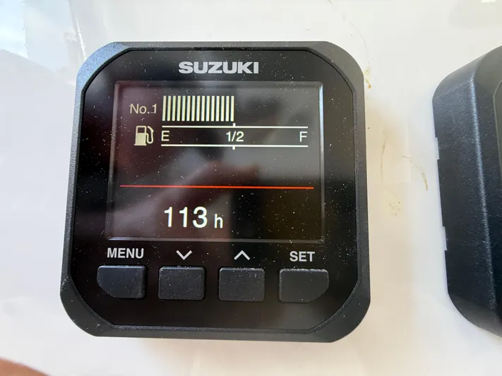  Yacht Photos Pics Suzuki digital gauge displaying fuel level and 113 hours on a 2024 Sea Pro 262DLX boat.