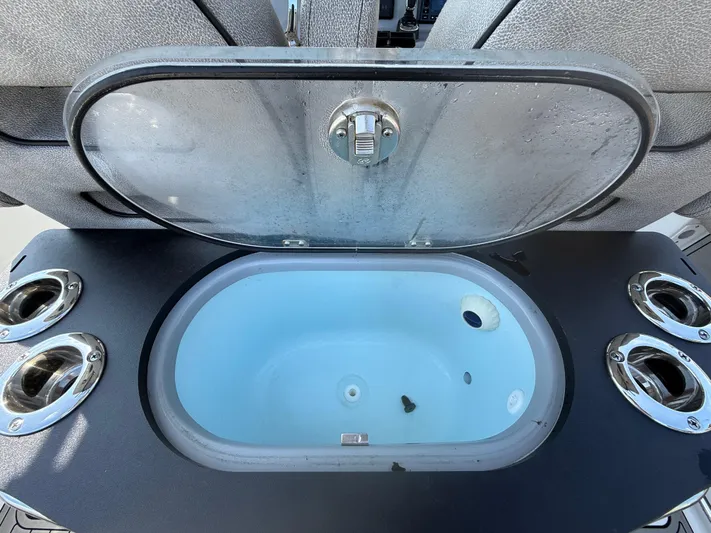  Yacht Photos Pics Livewell on 2024 Sea Pro 262DLX boat with rod holders and open lid.