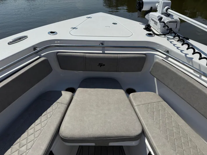  Yacht Photos Pics 2024 Sea Pro 262DLX boat interior with cushioned seating and modern design.