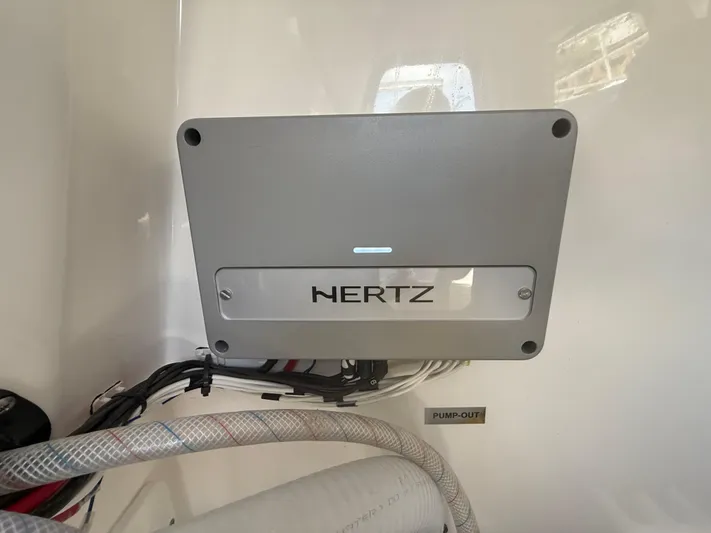  Yacht Photos Pics Hertz audio system in 2024 Sea Pro 262DLX boat, featuring pump-out label and wiring.