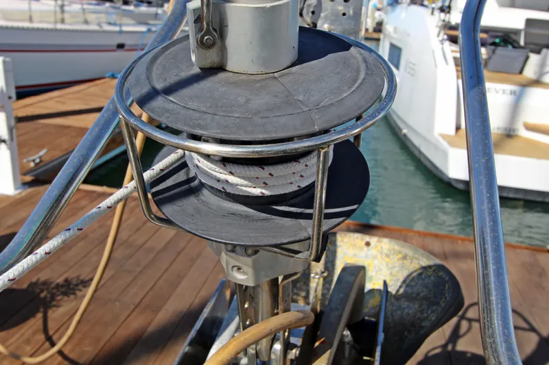  Yacht Photos Pics Close-up of a 2001 Beneteau Oceanis 461 sailboat's winch and rope system at a marina.