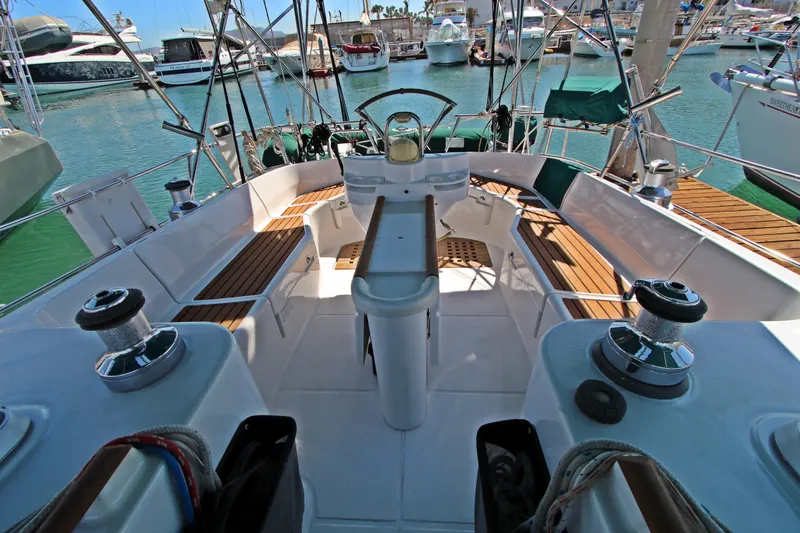  Yacht Photos Pics Cockpit of 2001 Beneteau Oceanis 461 sailboat, featuring teak seating and modern equipment.