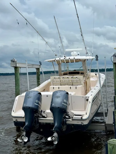  Yacht Photos Pics 2008 Grady-White Canyon 336 boat with dual Yamaha engines docked on a cloudy day.