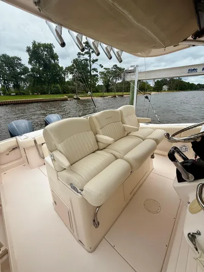  Yacht Photos Pics 2008 Grady-White Canyon 336 boat interior with plush seating and scenic river backdrop.