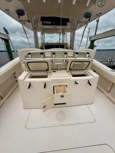  Yacht Photos Pics 2008 Grady-White Canyon 336 boat interior with open storage compartments and rod holders.