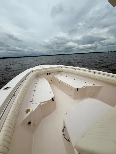  Yacht Photos Pics 2008 Grady-White Canyon 336 boat interior with seating, on a cloudy day at sea.