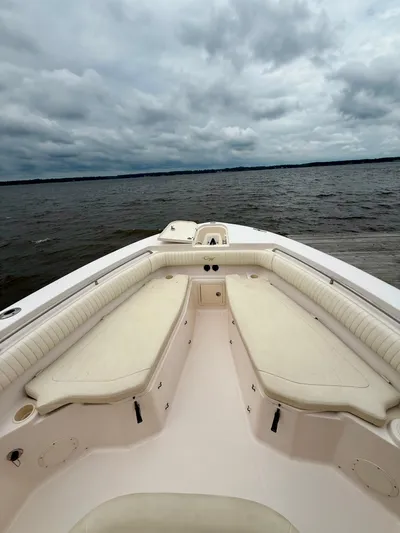 Yacht Photos Pics 2008 Grady-White Canyon 336 boat with spacious seating, overlooking a cloudy seascape.